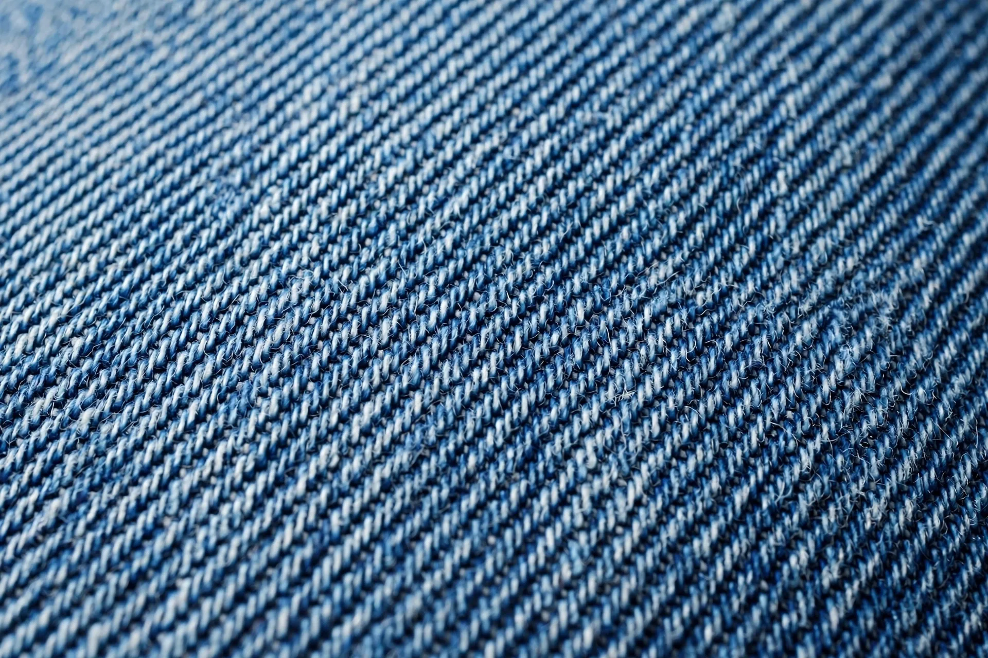 Close-up of denim fabric texture showing weave and stretch