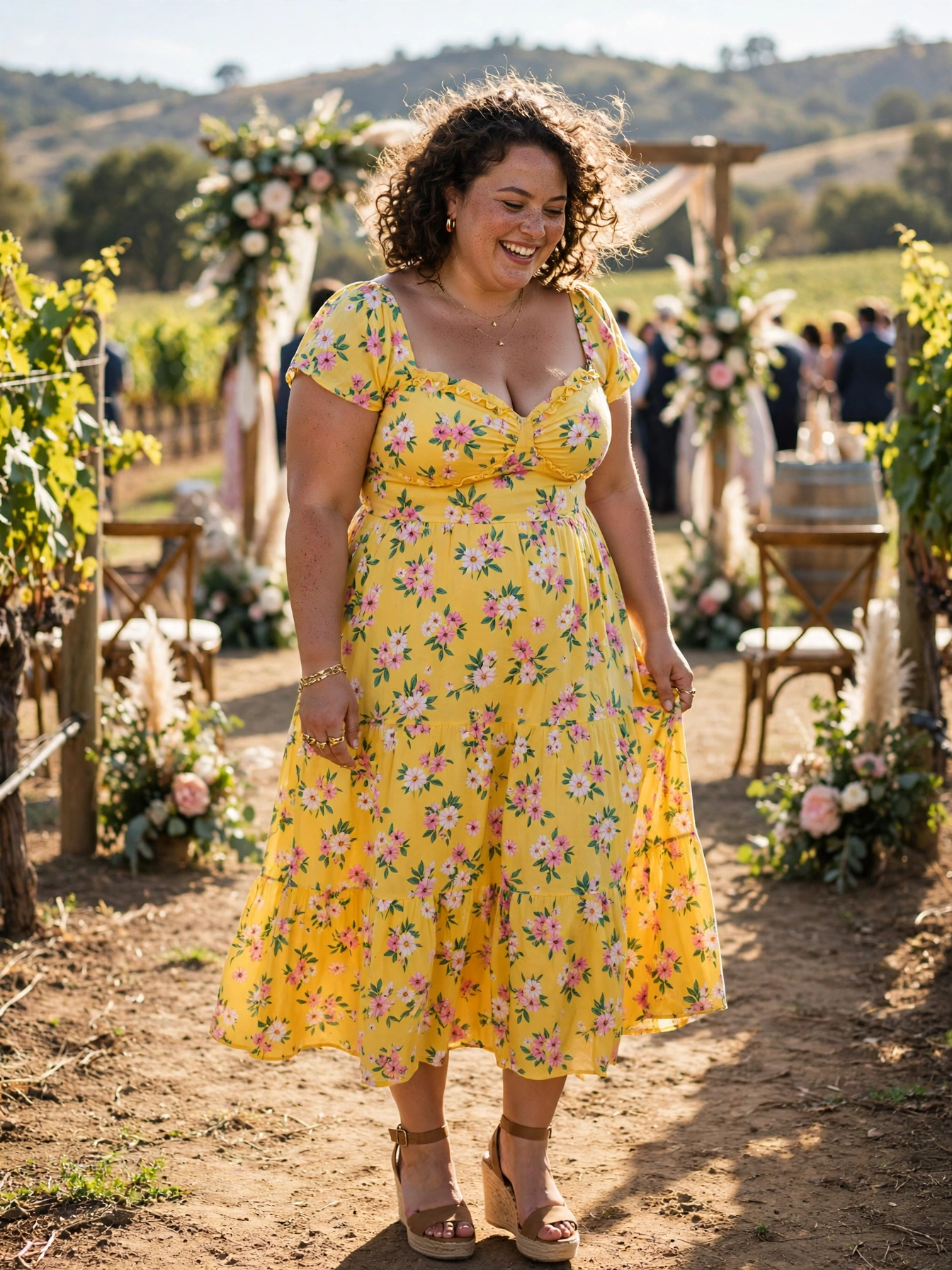 Plus-size woman in a yellow floral midi sundress with sweetheart neckline at a vineyard wedding